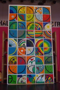 an image of a colorful art display with many different colors and shapes on the wall