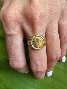 Vintage 9k Coin Signet Ring Ornate Shoulders Description: This vintage 9k coin signet ring features ornate shoulders, adding a unique touch to your collection. Sized at 6 and weighing 2.44g, the coin measures 11.8mm and showcases British hallmarks. This piece is perfect for adding a statement to any outfit. As with all our pieces, this ring is a rare find--once it's gone, it's gone. Choosing this piece helps you stand out from the crowd while supporting sustainable practices. Why You'll Love It: Sustainable Practices, Signet Ring, Jewelry Rings, Coin, Display Homes, Purses And Bags, Music Clothes, Ring, Trending Outfits