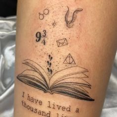 an open book with numbers and symbols on it, reading i have lived a thousand lives