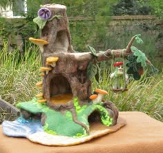 a small tree house made out of felt