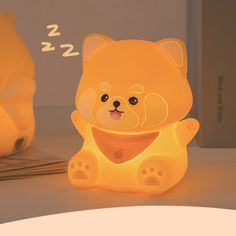 a yellow bear lamp sitting on top of a table