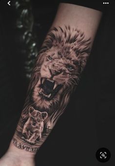 a man's arm with a lion and cub tattoo on it, while the other hand is holding his wrist