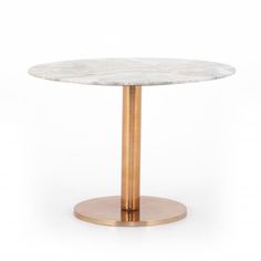 a round marble table with gold metal base