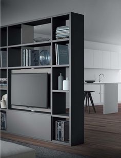 an entertainment center with bookshelves and television