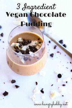 chocolate pudding in a small glass with whipped cream and chopped blackberries on the side