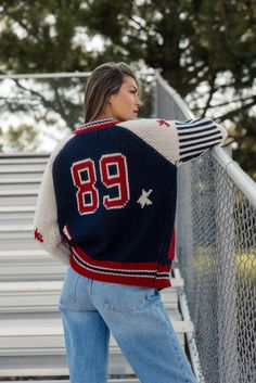 This sporty retro cardigan features a zip front + a letterman design. Perfect for those of us going back to school this year! A chunky knit and oversized fit give this cardi a cool girl look that you'll love this fall! ribbed hemlines patch pockets // paired with the wilder ribbed tank, trey mid rise skater jeans, + vans coming soon! Oversized Retro Varsity Jacket For College, Sporty Knit Sweater With Ribbed Collar, Varsity Style Jacket For Winter On Campus, Winter Varsity Jacket In College Style For Campus, Cozy College Sweater With Ribbed Cuffs, Oversized Varsity Sweater With Ribbed Cuffs, Winter Varsity Jacket With Letter Print For Game Day, Casual Varsity Jacket With Ribbed Cuffs For Game Day, Sporty Knit Outerwear For Fall