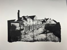 a black and white photo of houses on a hill