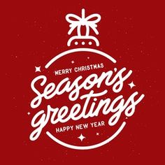 merry christmas greetings card with hand lettering and bauby ball on red background