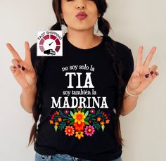 Floral Tia shirt,Mexican Madrina gift,Dia de la madre shirt,No soy solo la Tia soy tambien la Madrina,Spanish Mothers day,Tia shirt,Tia gift https://etsy.me/349fSXd  PRODUCT DESCRIPTION Please check the colors and sizes on the images! .: Retail fit .: 100% Soft cotton (fibre content may vary for different colors) .: Light fabric (4.2 oz/yd² (142 g/m .: Tear away label .: Runs true to size Machine wash: warm (max 40C or 105F); Non-chlorine: bleach as needed; Tumble dry: low heat; Iron, steam or d Spanish Mothers Day, Twill Tape, Cute Shirts, Small Gifts, Light Fabric, Gender Neutral, Mothers Day, Product Description, Adult Outfits