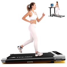 a woman is running on a treadmill with an appliance in the air