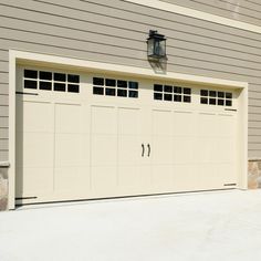 an overhead garage door is shown in front of a house