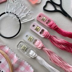 sewing supplies laid out on a table with scissors, thread, and other crafting items