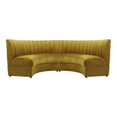 the curved couch is made from yellow velvet