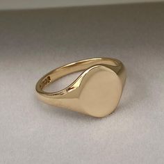 Pre - Owned Vintage British Jewellery Vintage 1940s 9ct yellow gold classic oval signet ring  Ring size - (This ring can be re-sized. Please contact for a quote) UK - V US - 10 1/2 # Hand engraving available #  Please contact for a quote! Metal - Solid 9ct yellow gold - Polished finish Face size - 13.2mm x 11.7mm  Weight - 5.52g Hallmark - Maker - ACCo, Metal - 9.375, Assay - Birmingham, Date - 1944 Overall condition - Excellent!    The signet ring comes in a lovely vintage style ring box! This British Jewellery, Oval Signet Ring, Jewellery Vintage, Vintage Style Rings, Us Size 10, Latest Updates, Solid Metal, Ring Ring, Vintage Jewellery