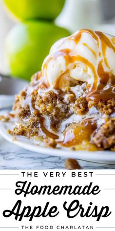 the very best homemade apple crisp on a white plate with caramel drizzle