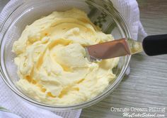 an orange cream filling in a glass bowl