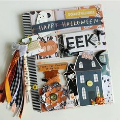 an assortment of halloween themed items on a white surface with text that reads happy halloween