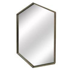 a mirror that is sitting on top of a white wall and has a metal frame around it