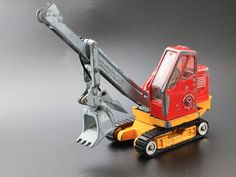 a toy truck with a shovel attached to it