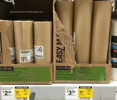 several rolls of brown paper sitting on top of a shelf next to each other in a store