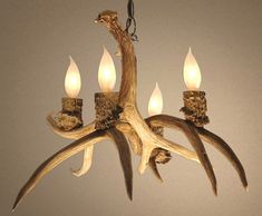 the antler chandelier has five candles in it