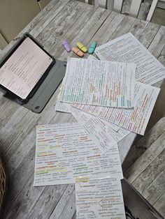 several pieces of paper sitting on top of a wooden table