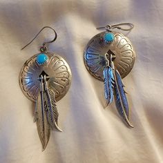 Sterling Silver Dangle Earrings Round Turquoise Stones Dangling Feathers Good Preowned Condition V Earrings Round, Silver Dangle Earrings, Sterling Silver Dangle Earrings, Turquoise Stones, Earrings Color, Turquoise Earrings, Round Earrings, Turquoise Stone, Blue And Silver