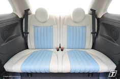 the interior of a car with blue and white seats