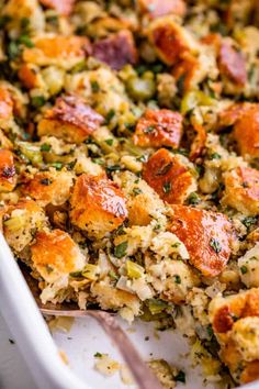 a casserole dish with sausage and stuffing