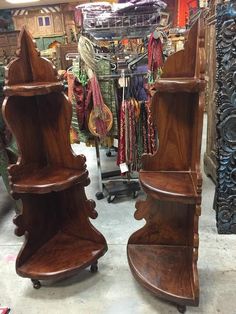 two wooden shelves sitting next to each other