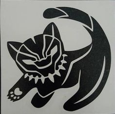 a black and white drawing of a cat on a wall