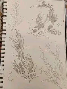 a drawing of two fish swimming in the water