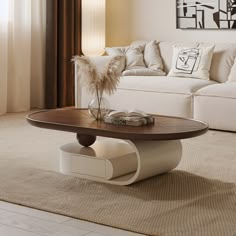 a living room with a couch, coffee table and white sofa in the background on carpeted flooring