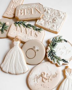 wedding cookies decorated with bride and groom's names are shown on a white surface