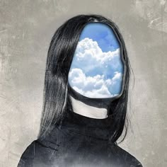 a woman's head with clouds in the background