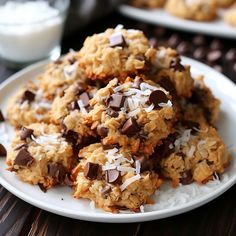 cookies with chocolate chips and coconut on a white plate