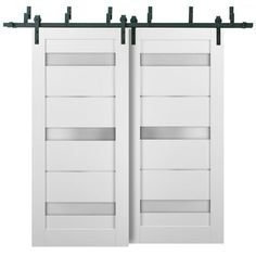 two white doors with metal bars on each side