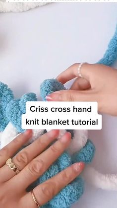 two hands holding a blue teddy bear with the text criss cross hand knit blanket