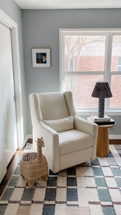 Glider in corner by window and closet for a modern nursery design. Paired with a side table and basket book storage for reading. Baby Boy Blue Nursery, Baby Boy Nursey, Nursery Room Colors, Neutral Boy Nursery, Boys Room Colors, Light Blue Nursery, Boy Nursery Design, Modern Boy Nursery, Baby Blue Nursery