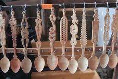 some wooden spoons hanging from a line