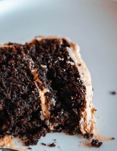 a close up of a piece of cake on a plate with a fork in it