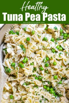 tuna and peas pasta in a pan with a wooden spoon