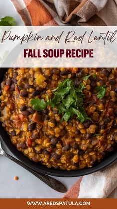 pumpkin and red lentil in a black bowl with cilantro on the side