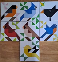 four pieces of paper with different colored birds on them