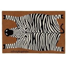 an animal rug with zebras on it