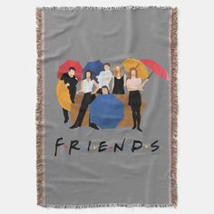 the friends throw blanket has an image of four people holding umbrellas and one is standing in front of them