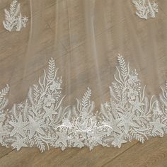 the white lace on this wedding veil is very delicate