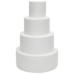 a three tiered white cake sitting on top of a table