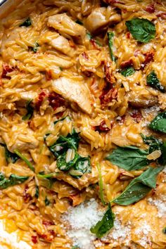 pasta with chicken and spinach in a pan