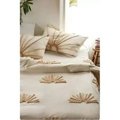 an image of a bed with pillows on it